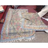 A pair of Myakka wool kilims with all over diamond decoration on pale blue ground within a triple