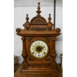 An early 20th Century German stained walnut cased mantel clock with American gong striking and