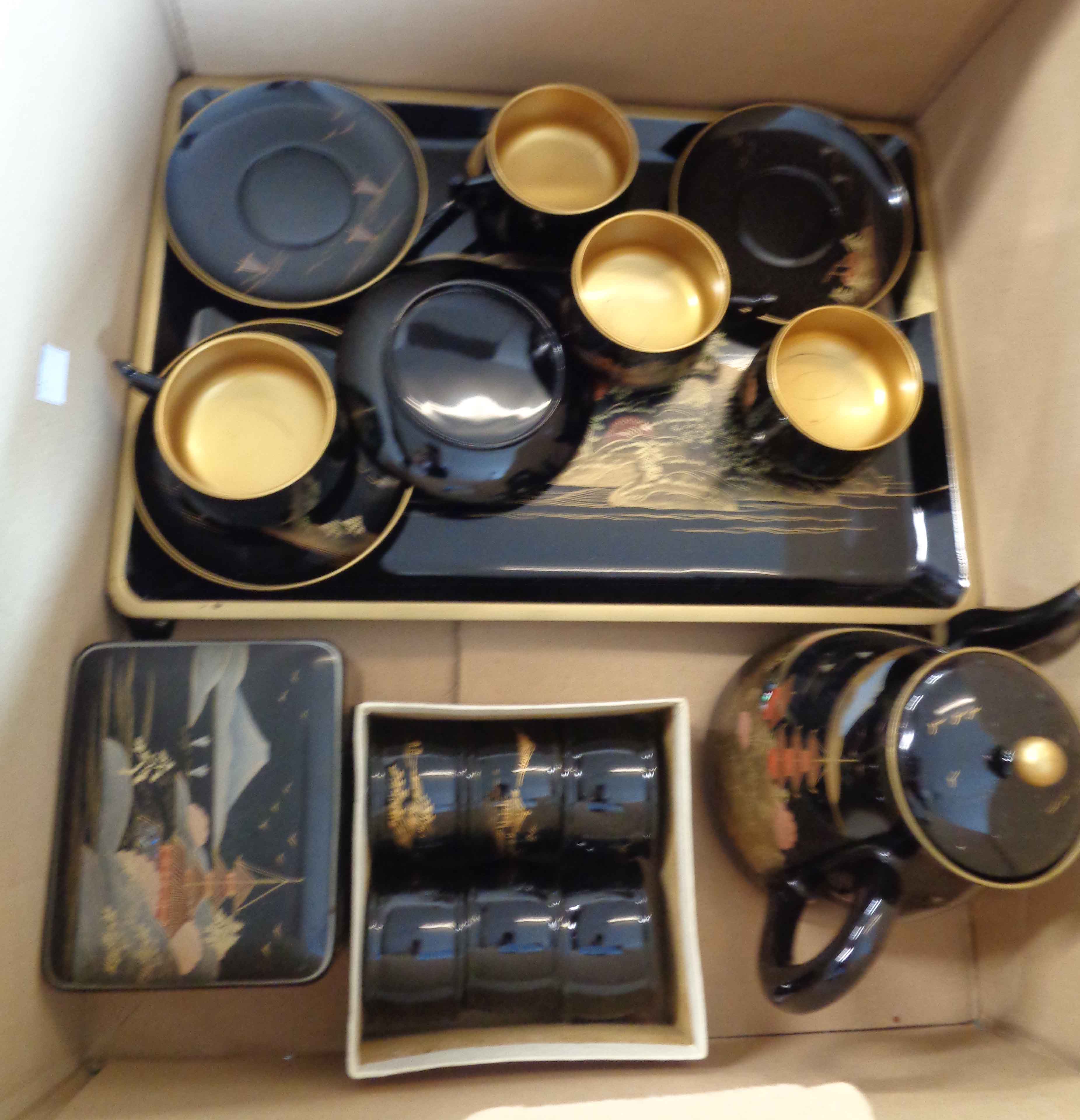 A vintage 1950's Japanese lacquerware set comprising tray, teapot, four cups and saucers, teaspoons,