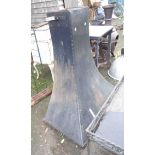 A large black painted metal fire hood