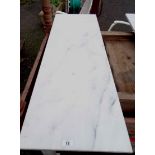 A solid white marble table top - 1.22m X 40.5cm