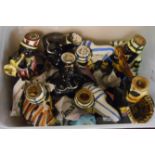 A tub containing a set of seven Italian pottery liqueur bottles depicting a musical band and another