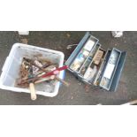 A vintage cantilever tool box containing a quantity of assorted tools including spanners, sockets,