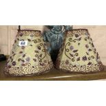 A pair of lampshades with applied floral beadwork