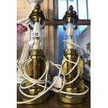 A pair of modern reproduction Great Eastern Railway table lamps of candle sconce form with glass