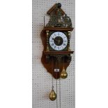 A 20th Century Zandaam mahogany and brass mounted wall clock with Hercules figure to top of bell and