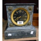 A late Victorian black slate cased mantel clock with flanking lion mask ring handles and Japy Freres