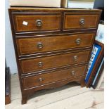 A 61cm Edwardian mahogany, cross banded and strung chest of two short and three long drawers, set on