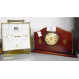 A vintage Swiza heavy brass cased alarm clock - sold with a small early 20th Century timepiece