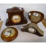 Three assorted small timepieces - sold with a small wall barometer with visible aneroid works