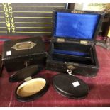 Two old leatherette clad jewellery boxes - sold with a pair of ebonised wood oval trinket boxes