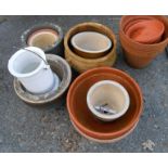 A quantity of assorted terracotta and other garden pots