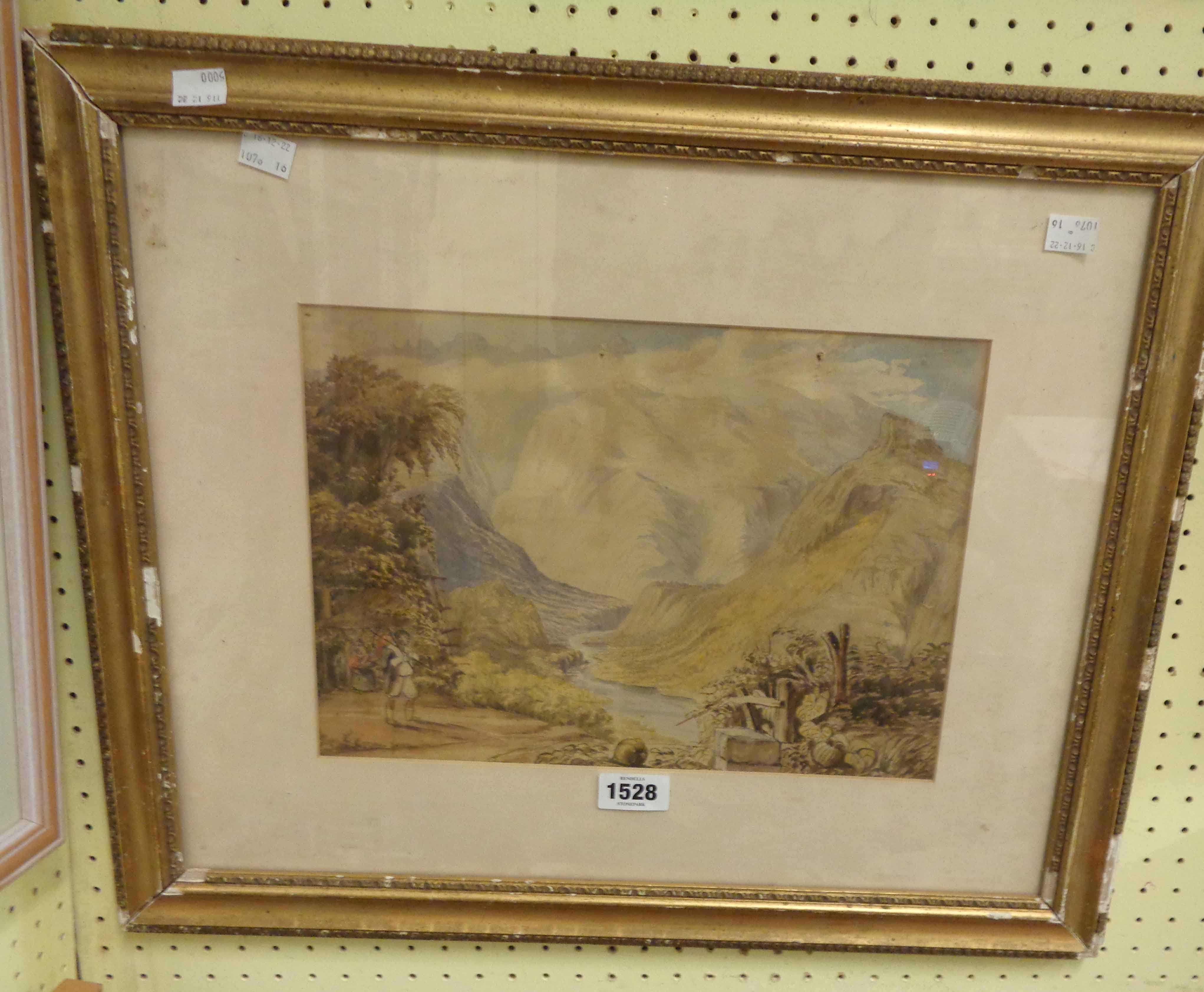 A gilt framed 19th Century watercolour, depicting a river mountain landscape - faded