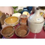 A small selection of part glazed terracotta bowls - sold with a stoneware flagon of shouldered form