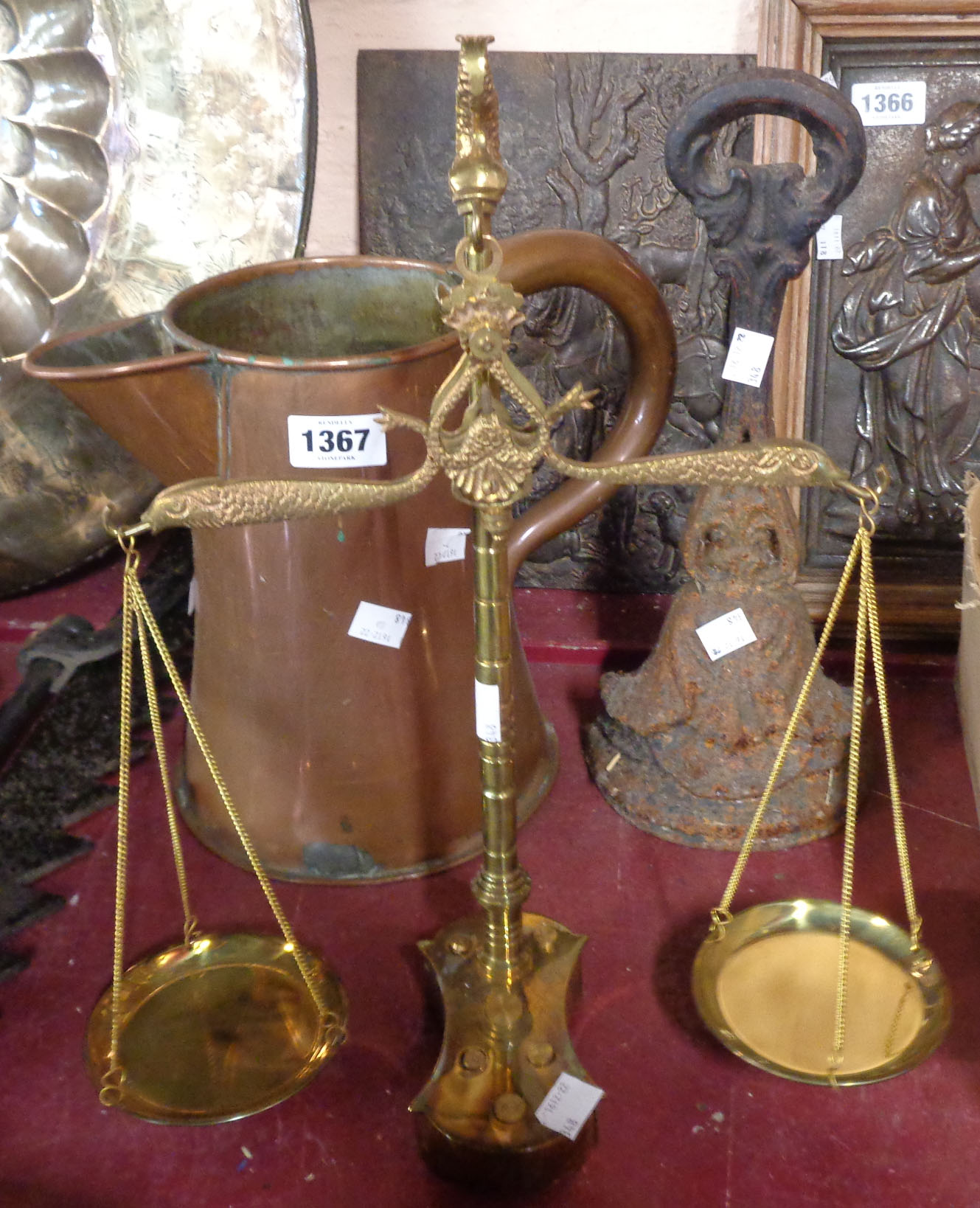 A small selection of assorted metalware comprising large copper jug, Victorian cast iron doorstop