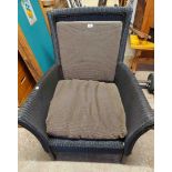 A modern Lloyd Loom armchair with upholstered back rest and cushion