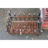 A small cast iron fire grate