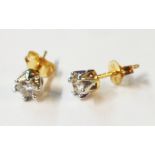 A pair of 750 (18ct.) gold diamond solitaire stud ear-rings - boxed