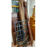 A mixed wood reproduction four poster bedstead with associated turned and reeded uprights and