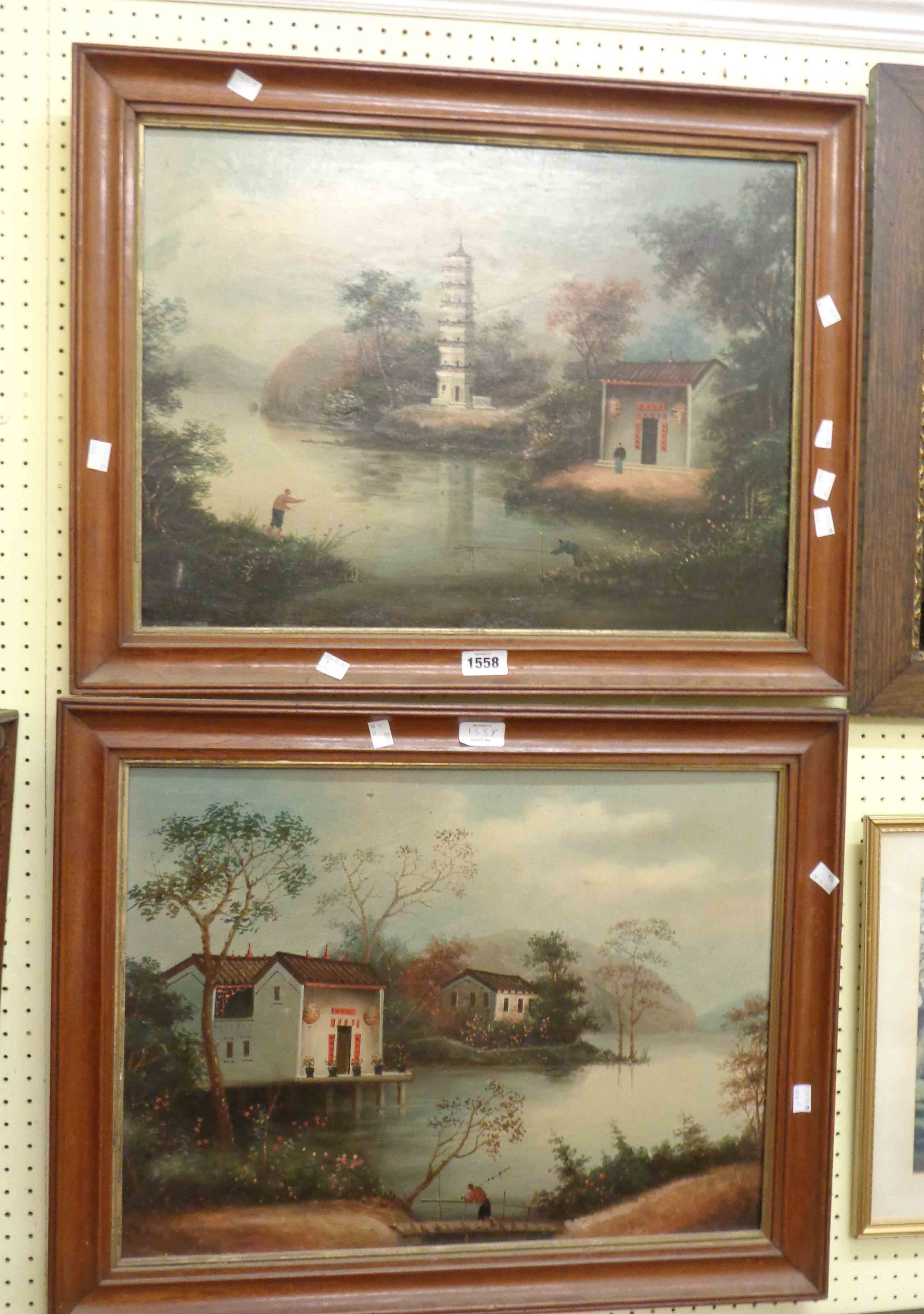 A pair of framed Chinese oils on canvas, both depicting waterside scenes with figures and