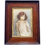 AW: a polished oak framed and gilt bordered watercolour, depicting a young girl wearing a smock -