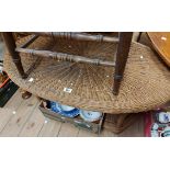 A 100cm John Lewis wicker oval topped two tier table, set on bound supports