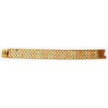 A 375 (9ct.) three colour gold mesh-link bracelet with snap clasp - boxed