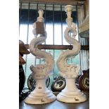 A pair of large Roger Pradier cast aluminium table lamps of grotesque fish form with white painted