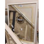 Two white framed Warsteiner lager advertising wall mirrors with applied central bosses