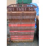 Twenty-five plastic stacking apple crates