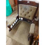 An Edwardian stained wood part show frame drawing room armchair with piped olive velour