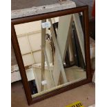 A vintage frameless triple dressing table mirror with bevelled arched plate - sold with a stained