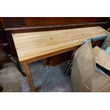 A 1.2m Ikea pine kitchen table, set on square legs