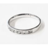 A 375 (9ct.) white gold diamond set half eternity ring - size M - boxed