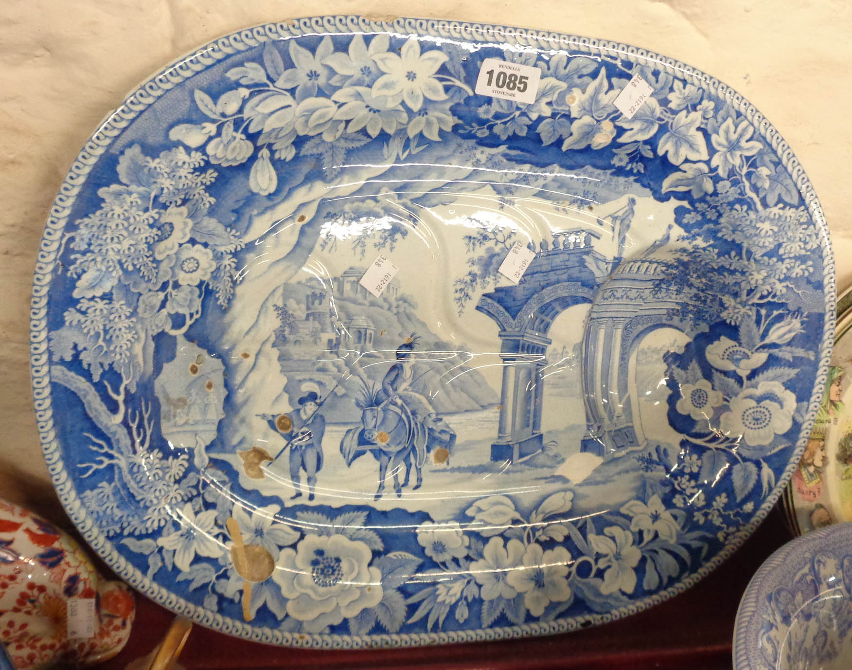 A 19th Century Clews stone china meat platter with moulded gravy well and blue and white transfer