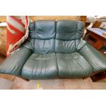 A 1.55m Stressless two seater individual reclining settee upholstered in green leather