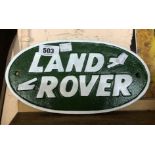 A modern painted cast iron Landrover sign