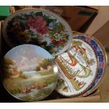 A box containing a quantity of collectors' plates