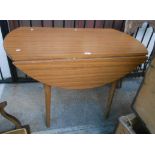 A 1.1m vintage drop-leaf dining table with woodgrain Formica finish