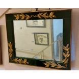 An 80cm vintage decorative wall mirror with applied gilt foliage to green velvet border