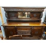 A 1.83m late Victorian stained carved oak mirror back sideboard with flanking bulbous supports and