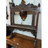 A 78cm late Victorian carved oak screen frame with armourial, text and acanthus scroll decoration