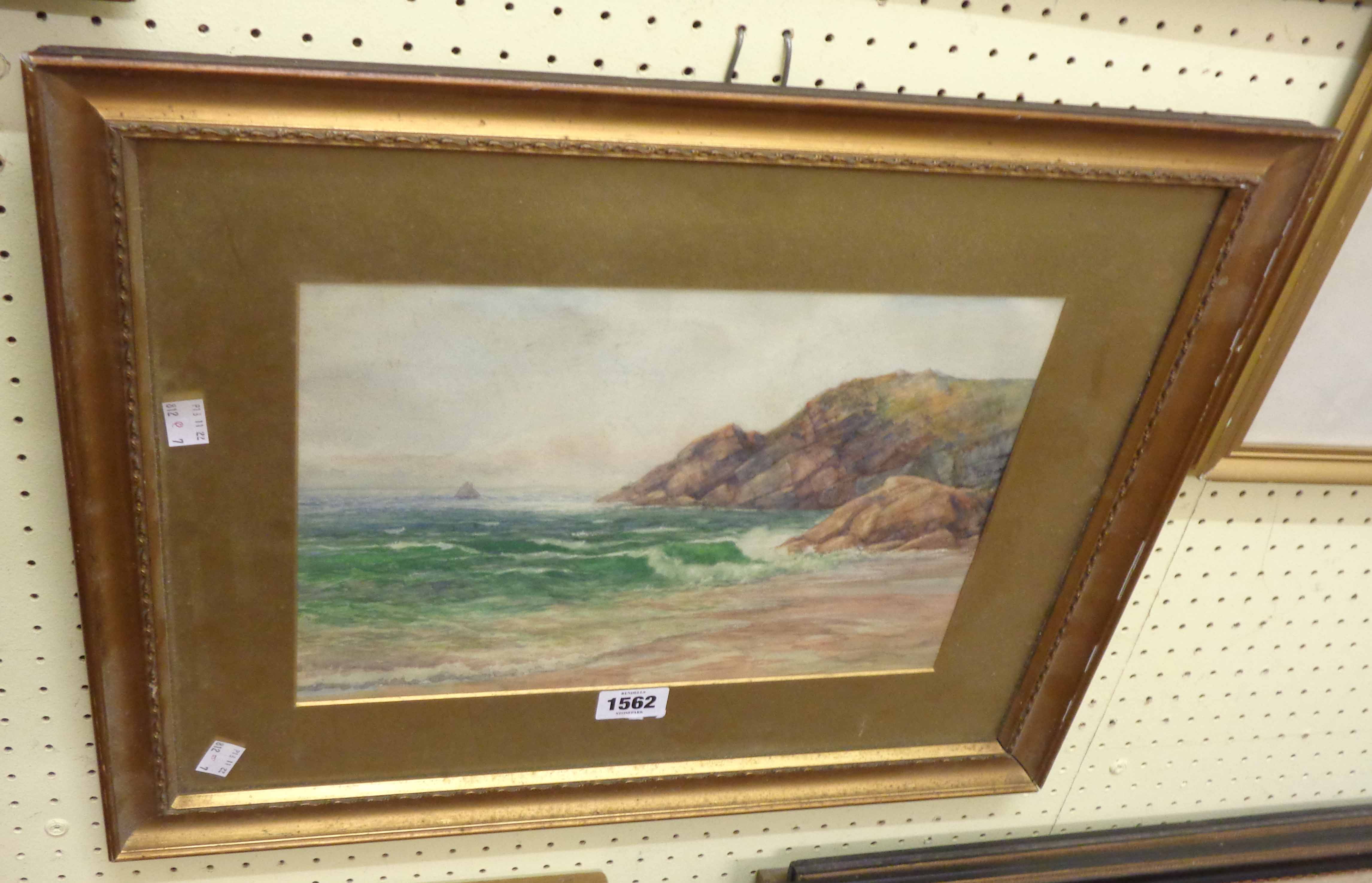 A gilt framed and slipped watercolour, depicting a coastal view with cliffs and sailing vessel in