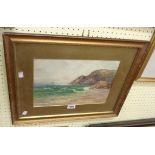 A gilt framed and slipped watercolour, depicting a coastal view with cliffs and sailing vessel in