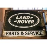 A modern reproduction printed tin Landrover Parts & Service sign