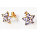 A pair of 375 (9ct.) gold tanzanite cluster star pattern earrings - boxed