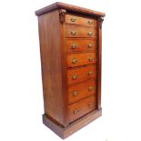 A 61cm late Victorian mahogany Wellington chest with flight of seven bracket locking graduated