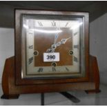 A mid 20th Century Art Deco style oak cased mantel clock with eight day chiming movement