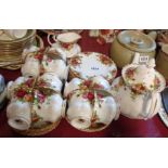 A Royal Albert tea set comprising teapot, twelve trios, milk and sugar