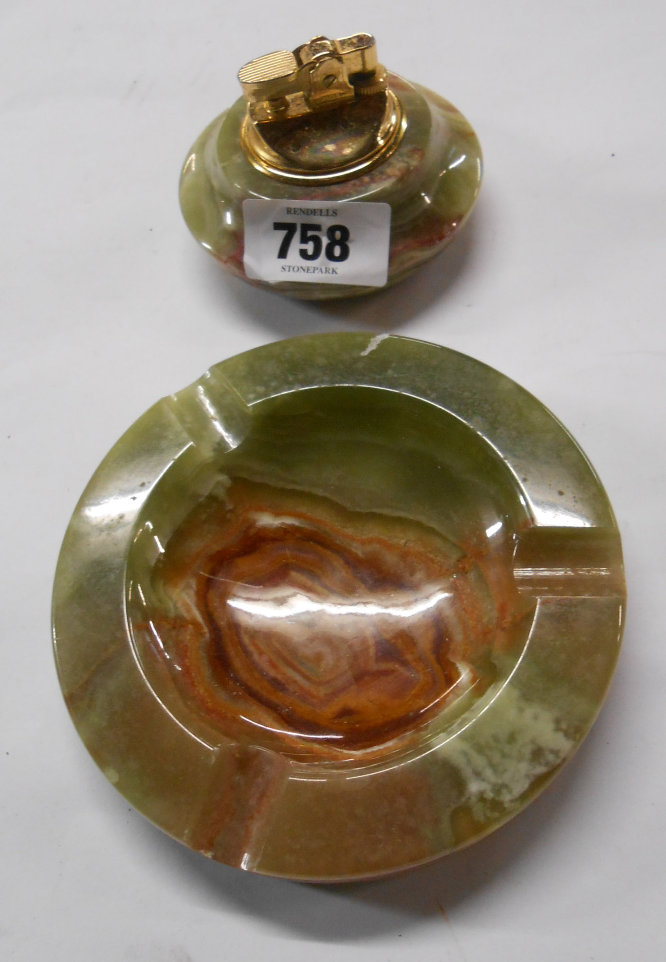 A vintage onyx table lighter and ashtray